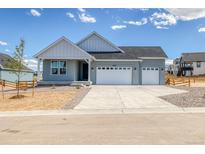 Charming single-Gathering home featuring a two-car garage and stylish architectural details at 39628 Yorktown Ter, Elizabeth, CO 80107