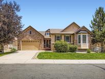 Charming brick home featuring a meticulously maintained front lawn at 14310 Kalamath St, Westminster, CO 80023