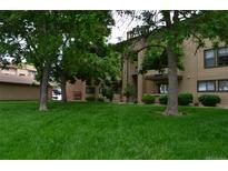 Multi-Gathering building with green space and mature trees provides a peaceful, park-like setting at 400 Zang St # 1-105, Lakewood, CO 80228