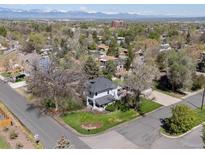 Beautiful home with a well-maintained yard, mature trees, and a charming front porch to enjoy quiet evenings at 5801 W 33Rd Ave, Wheat Ridge, CO 80212