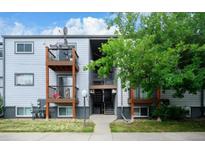 Multi-level apartment building with wood balconies and well-maintained landscaping at 16259 W 10Th Ave # J5, Golden, CO 80401