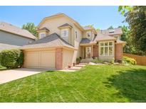 Charming two-story home featuring a well-manicured lawn and attached two car garage in a desirable location at 16438 E Prentice Cir, Centennial, CO 80015