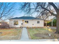 Charming single-story home with a welcoming walkway and a convenient carport at 1050 Uvalda St, Aurora, CO 80011