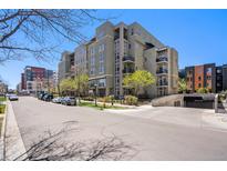 Attractive condo building featuring balconies and a convenient underground parking garage at 275 S Harrison St # 210, Denver, CO 80209