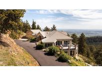 Stunning mountain home with a spacious deck and breathtaking views of the valley below at 1426 Rembrandt Rd, Boulder, CO 80302