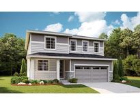 Beautiful two-story home featuring gray siding, stone accents, an attached two-car garage, and a welcoming front porch at 1354 Sienna Peak Cir, Erie, CO 80516