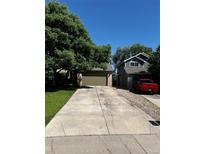 Charming home with a well-manicured lawn and a two-car garage at 5201 E 127Th Dr, Thornton, CO 80241