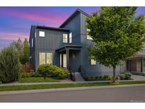 Charming two-story home featuring modern architecture, a well-manicured lawn, and lush landscaping at 6760 Mariposa Ct, Denver, CO 80221