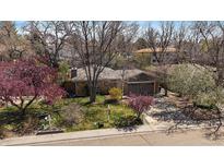 Charming single-story home with a well-maintained front yard and a two-car garage at 1746 Shavano St, Longmont, CO 80504