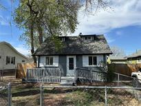 Charming home featuring a fenced yard and welcoming front porch, perfect for enjoying the outdoors at 253 7Th St, Frederick, CO 80530
