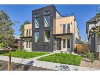 Modern two-unit building with dark brick and light wood accents at 3916 N Mariposa St, Denver, CO 80211