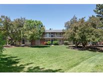 Beautiful condo with a large front yard and mature trees for shade and privacy at 6495 E Happy Canyon Rd # 114, Denver, CO 80237