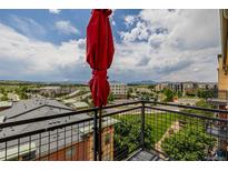 Relax on this spacious balcony, offering stunning views and a perfect spot for enjoying the outdoors at 13456 Via Varra # 401, Broomfield, CO 80020