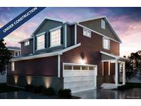 New construction home featuring a two-car garage, welcoming porch, and craftsman-style details at 22392 E 38Th Pl, Aurora, CO 80019