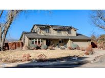 Two-story house with landscaped yard, attached garage, and mountain views at 7913 Grasmere Dr, Boulder, CO 80301