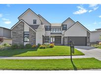 Beautiful two-story home featuring modern architecture, stone accents, and well-manicured landscaping in a great location at 2230 Rim Ridge Dr, Castle Pines, CO 80108