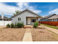 Charming single-story home with gravel front yard and inviting walkway to the front door at 436 S 4Th Ave, Brighton, CO 80601