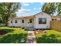 Charming home with a well-manicured lawn and inviting walkway, showing great curb appeal at 4467 N Umatilla St, Denver, CO 80211