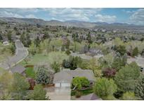 Expansive aerial view of the home and surrounding neighborhood with mountain backdrop at 13959 W Cedar Pl, Golden, CO 80401