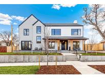 Inviting two-story home with modern farmhouse style and manicured front yard at 4520 W Moncrieff Pl, Denver, CO 80212