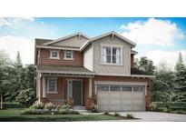 Charming two-story home with a two-car garage, stylish architecture, and manicured landscaping at 7357 S Yank Ct, Littleton, CO 80123
