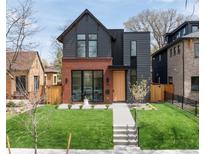 Striking two-story home showcases modern design and lush front yard at 716 S Race St, Denver, CO 80209