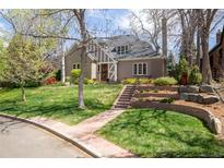 Charming two-story home with a landscaped front yard, brick accents, and inviting curb appeal at 350 Albion St, Denver, CO 80220