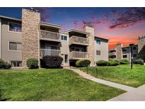 Well-maintained condo complex featuring stone accents, private balconies and landscaped grounds at 381 S Ames St # G101, Lakewood, CO 80226