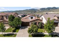 Charming single-Gathering home with well-manicured lawn and beautiful mountain views at 15290 W Baker Ave, Lakewood, CO 80228