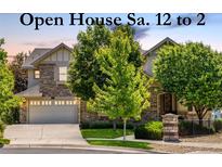 Charming two-story home with stone accents, manicured lawn, and an attached two-car garage. Open house this Saturday! at 27565 E Nova Pl, Aurora, CO 80016