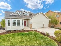 Charming home featuring a manicured lawn, two car garage, and a beautiful bay window for ample natural light at 735 Chesapeake Ave, Monument, CO 80132