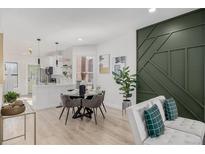 Bright living space with modern decor, stylish furniture, and open-concept dining area at 561 Cherokee St, Denver, CO 80204