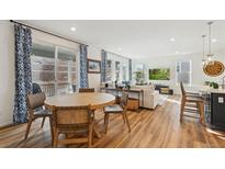 Bright living room with hardwood floors and abundant natural light at 17214 W 94Th Ave, Arvada, CO 80007