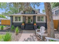 Charming renovated bungalow with a welcoming front porch and dark brick accents, ready for relaxing in this vibrant neighborhood at 805 Elm St, Denver, CO 80220