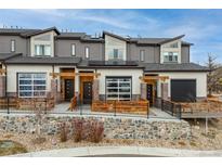 Modern townhome featuring a beautiful facade and well-maintained landscaping at 10105 Morrison Rd, Lakewood, CO 80227