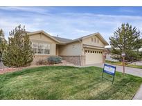 Charming single-Gathering home featuring a well-maintained lawn and inviting two-car garage at 23730 E Otero Dr, Aurora, CO 80016