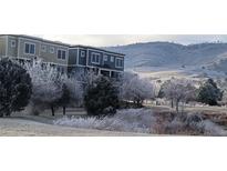 Beautiful condo exterior showcasing the neighborhood and the frosted winter landscape at 911 Laramie Blvd # B, Boulder, CO 80304