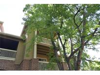 Charming condo featuring double balconies with brick and siding exterior accents at 1631 W Canal Cir # 832, Littleton, CO 80120