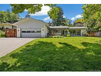 Charming single-story home featuring a well-manicured lawn, classic design, and a welcoming front entrance at 937 S Cole Dr, Lakewood, CO 80228