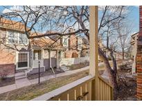 Townhome community with well-kept yards, brick accents, and welcoming front porches at 2062 S Helena St # B, Aurora, CO 80013