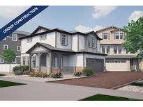 Charming two-story home featuring a covered front porch, attached garage, and beautifully landscaped front yard at 1187 Highview Dr, Erie, CO 80516