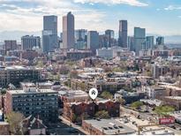 Beautiful Denver city skyline view from this charming brick apartment building, in a walkable neighborhood at 1475 N Humboldt St # 22, Denver, CO 80218