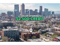 An aerial view of a building in a vibrant city, showcasing a $2500 credit for the buyer at closing at 1475 N Humboldt St # 22, Denver, CO 80218