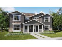 Two-story craftsman style home with gray siding and stone accents at 15267 Fillmore St, Thornton, CO 80602