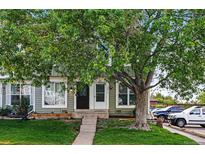 Charming townhome featuring well-maintained front yard, classic design and inviting entrance at 2291 S Jasper Way # B, Aurora, CO 80013