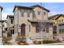Charming two-story home featuring a landscaped front yard, a covered entry, and an inviting facade at 15525 W La Salle Ave, Lakewood, CO 80228