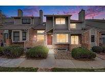 Charming townhome with a mix of brick and siding, complemented by well-manicured bushes, enhancing its curb appeal at 15149 E Princeton Pl # D, Aurora, CO 80014