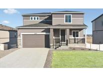 Two-story house with attached garage and landscaped lawn at 18155 Martinello Dr, Parker, CO 80134