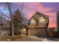 Two-story house with attached garage and landscaping at 11173 W Fremont Pl, Littleton, CO 80127