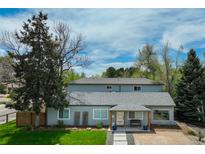 Charming gray home with a well-maintained front yard and a welcoming front porch at 4790 E Dartmouth Ave, Denver, CO 80222